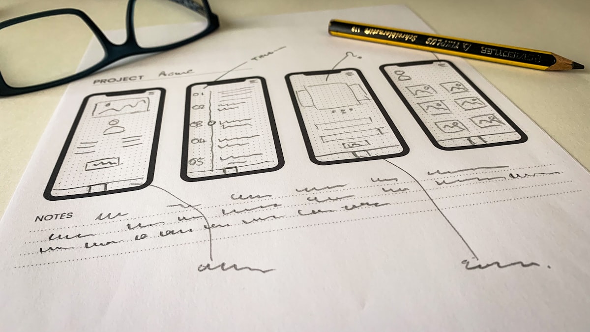 Wireframes and sketches on paper — app design process