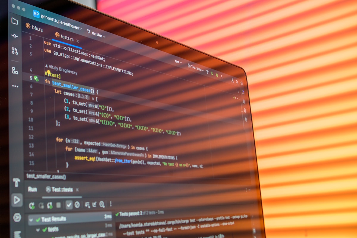 Laptop screen displaying colorful code — software engineering